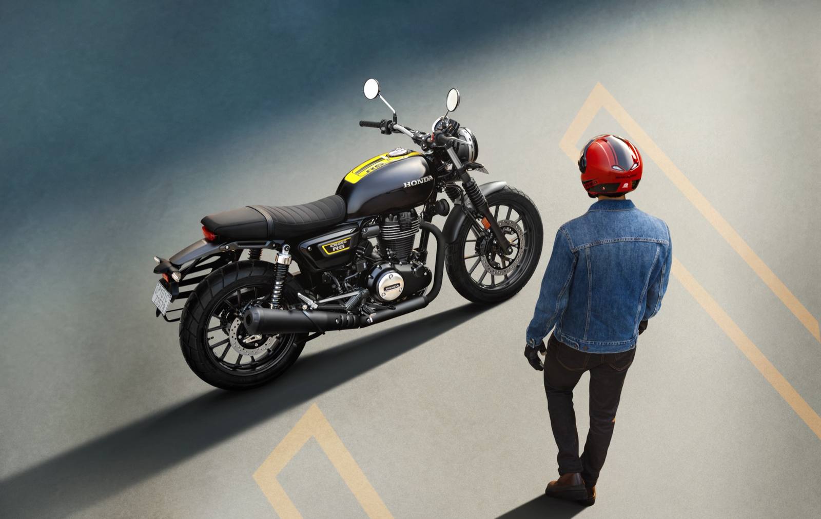 Rider walking to a Honda CB350RS